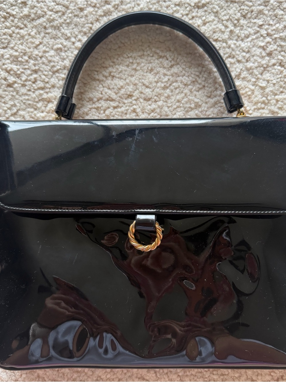 Vintage black patent leather handbag with gold hardware